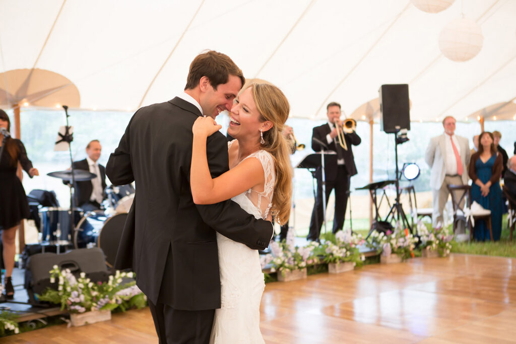 Happy married couple dancing at their wedding